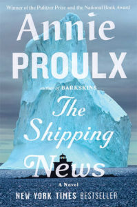 Front cover of Annie Proulx's The Shipping News featuring a giant blue, white iceberg and a silouette of a ship.